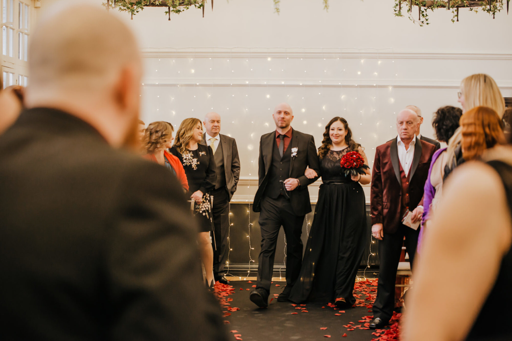 Wedding ceremony , white dress, black suit, red shirt, ring ceremony