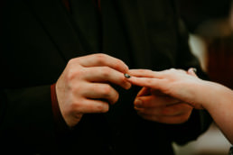 Wedding ceremony , white dress, black suit, red shirt, ring ceremony