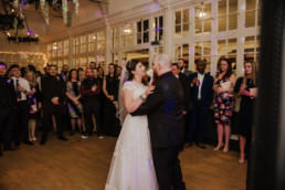Dancing couple at the wedding reception Shenley cricket club , white wedding dress, black and red themed wedding