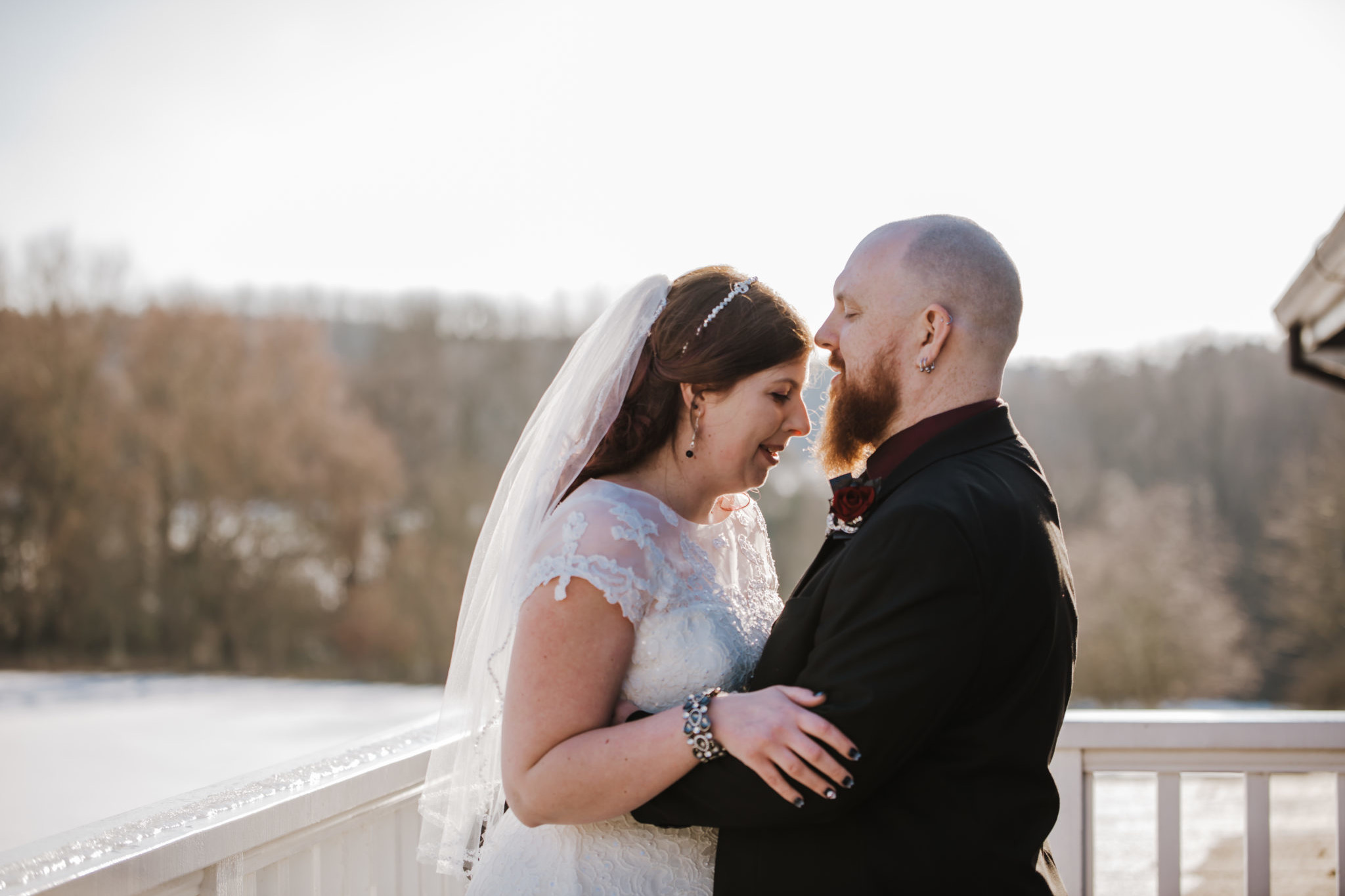 Sarah and Sam wedding couple outside Shenley Cricket club for thei