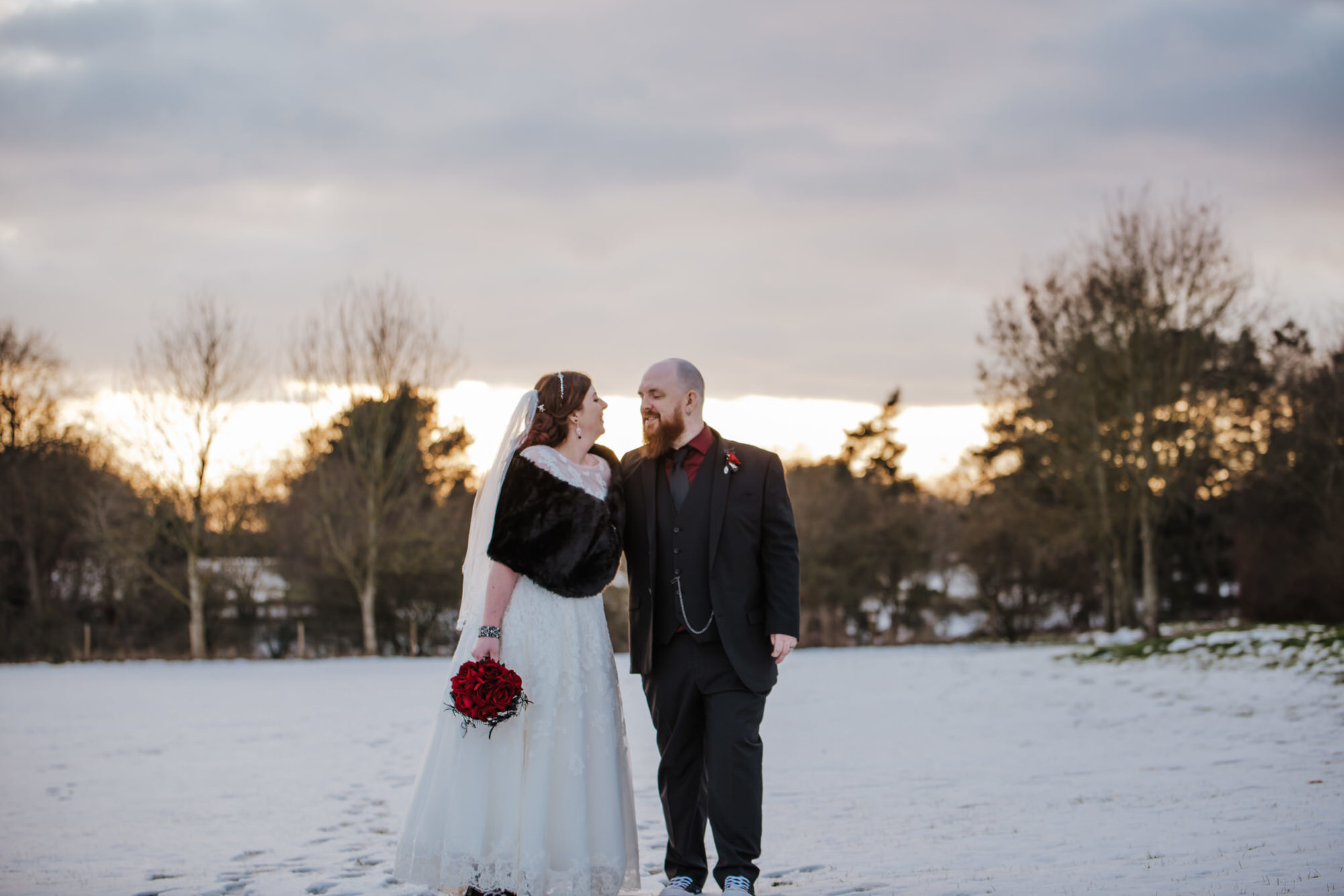 Sarah and Sam weddiing couple outside Shenley Cricket club for thei