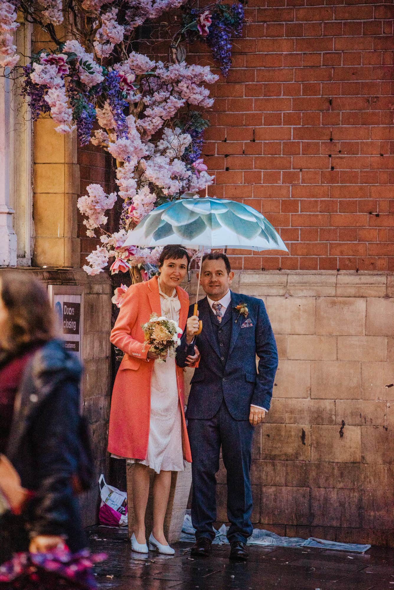 Katya in silk vintage weddign dress, Brett in blue suit at the Old Marylebone registry office London couples shot at the Piccadilly circus
