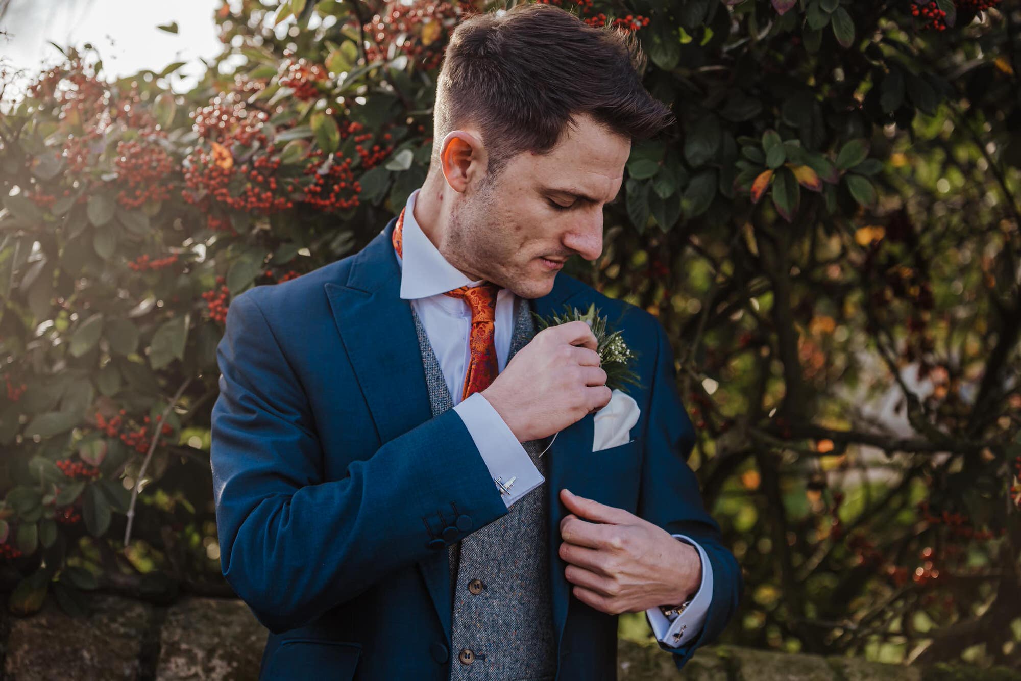 Groom in blue suits outside the barn before the wedding Roshni photography The Milling Barn, Bluntswood Hall, Throcking wedding photographer