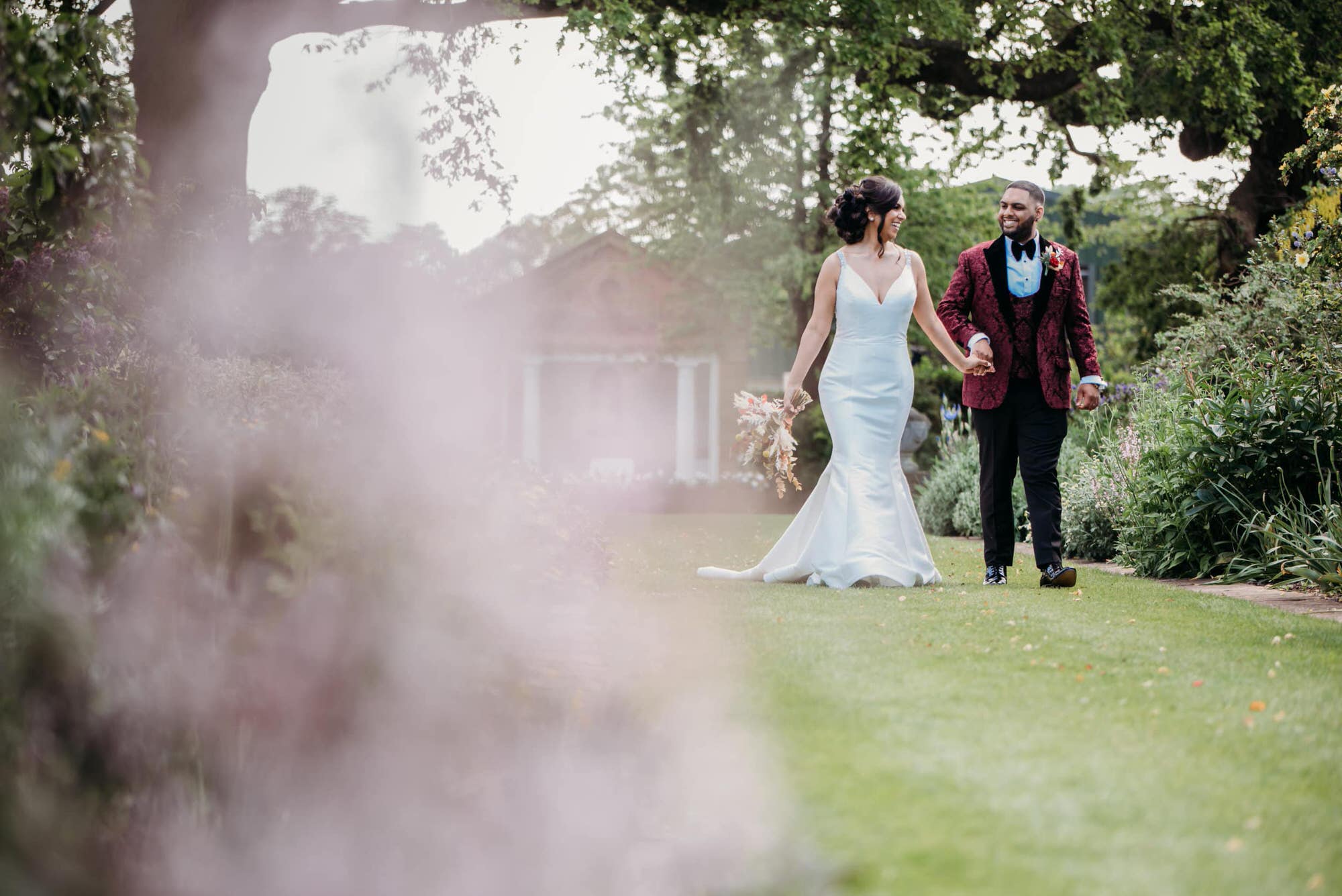 micklesfield-hall-hertfordshire-fusion-wedding-photographer-roshni-photography-couple-walking