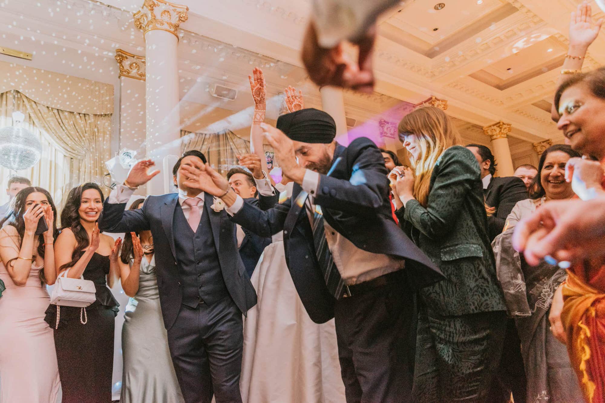 the-langham-london-asian-wedding-photographer-roshni-photography-guests-dancing