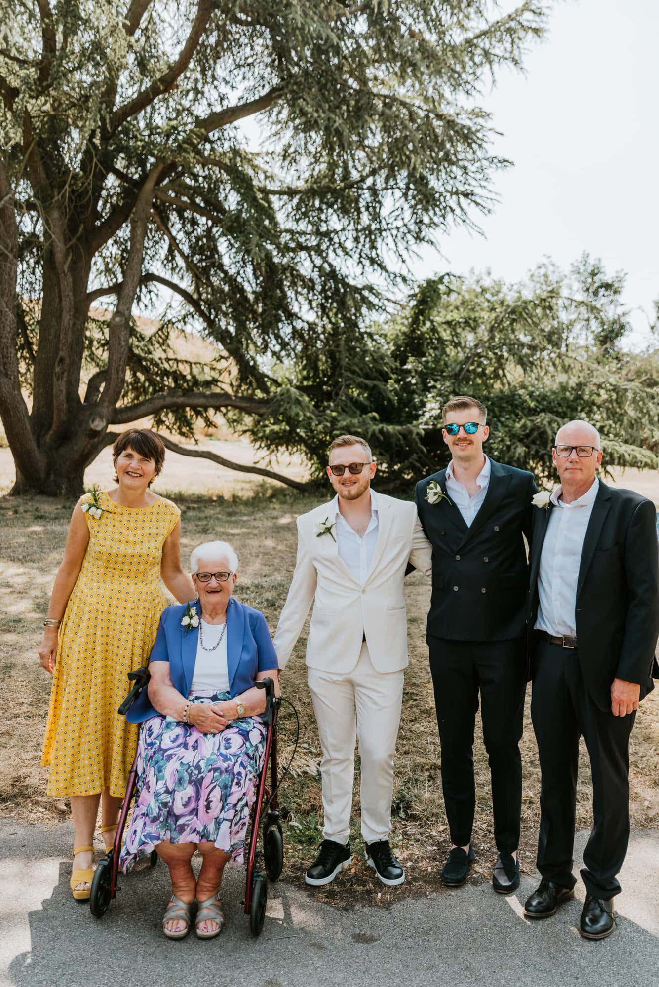 family picture of parents, grooms and grandma
