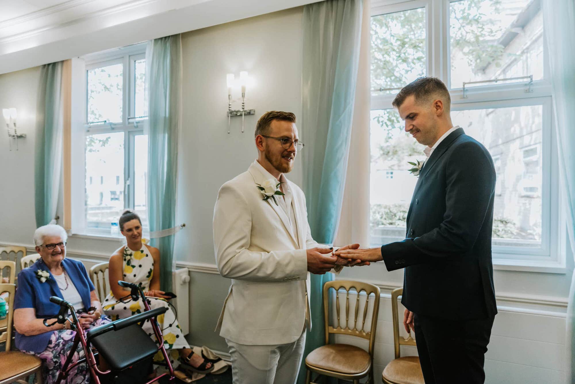 ring exchange at the town hall room, green curtains