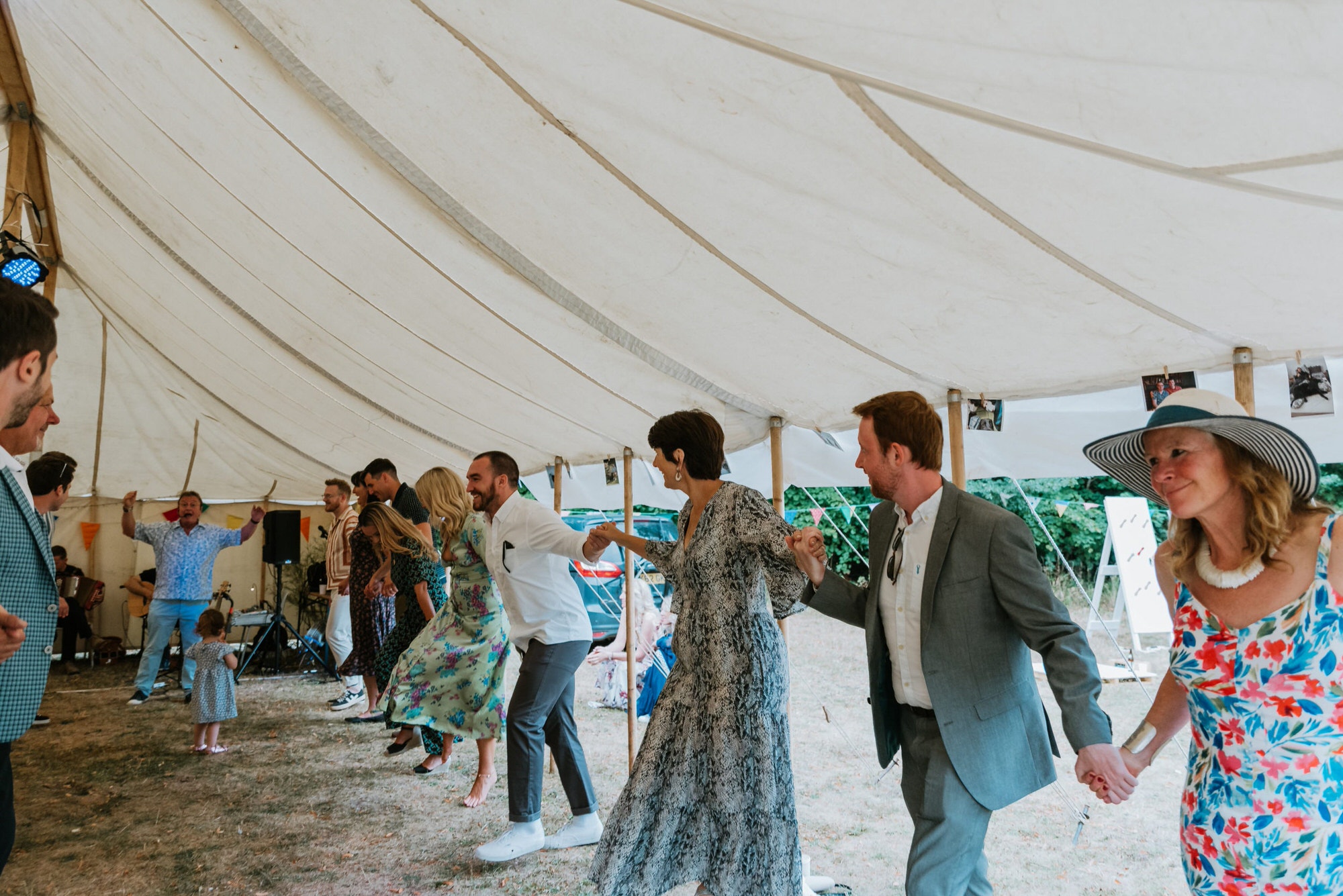 ceilidh dancing with the guests under a tipi