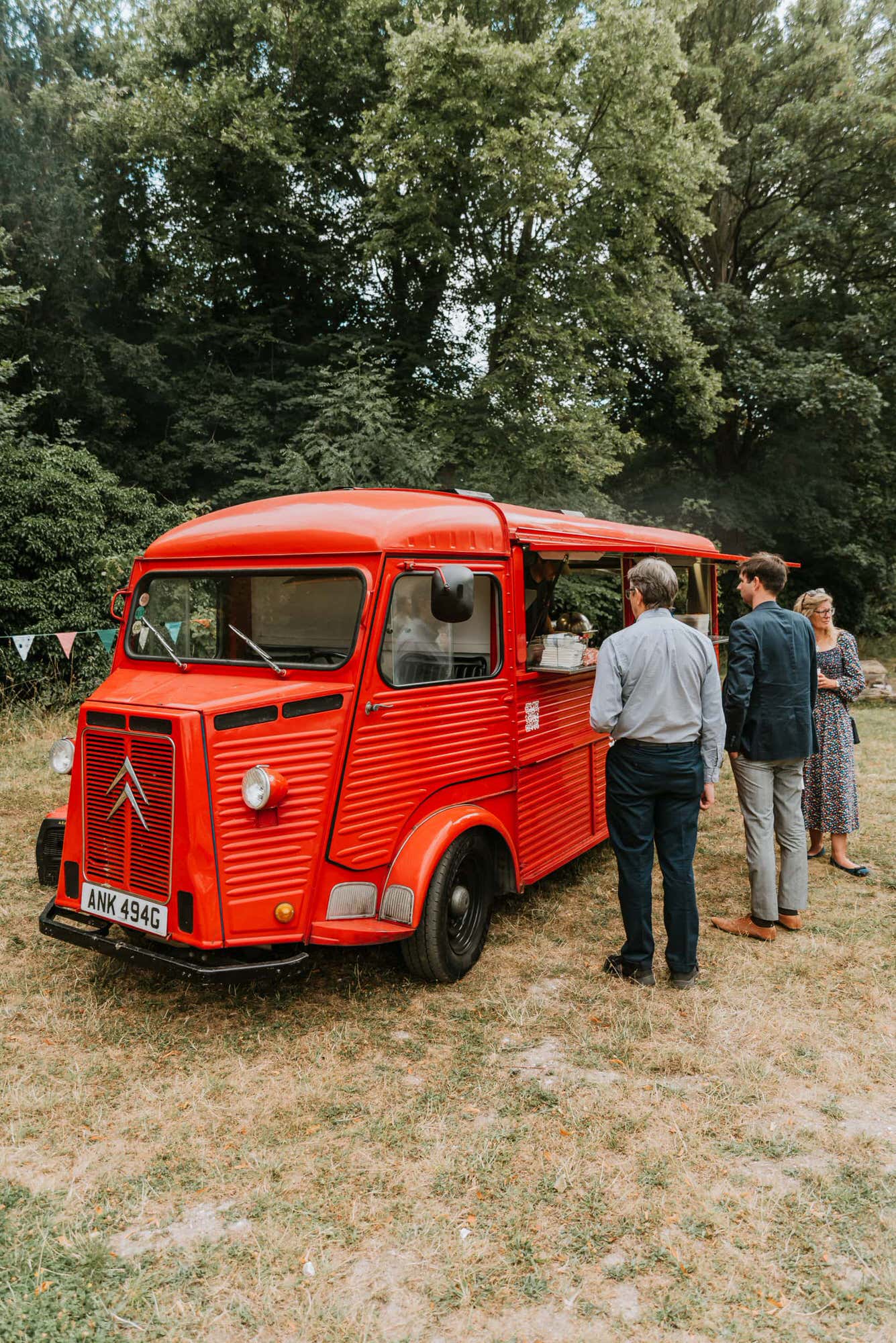 Red burger van at the wedding reception field