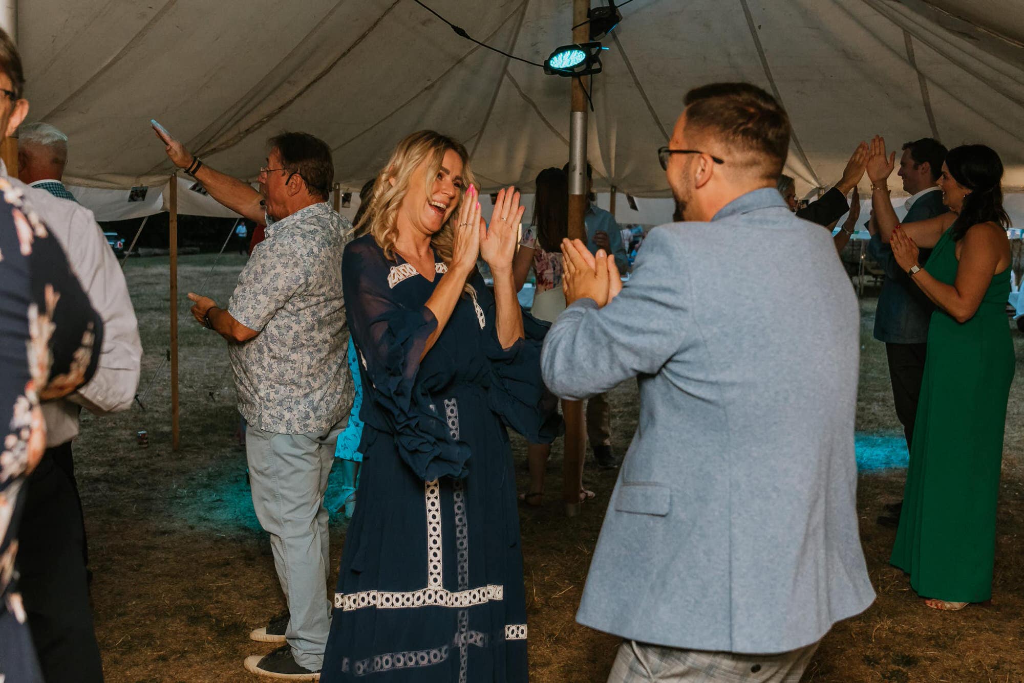 ceilidh dancing with the guests under a tipi