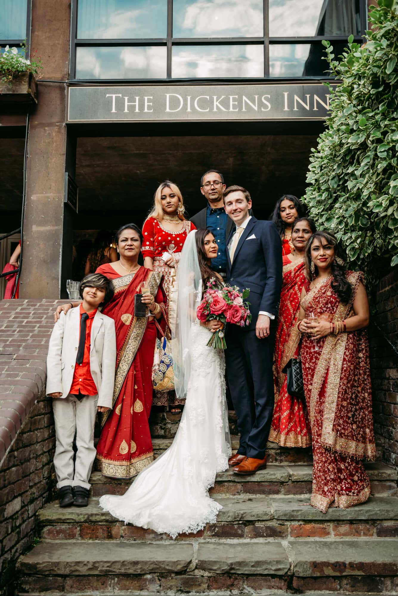 dickens-inn-tower-hill-london-london-fusion-wedding-photographer-group-photo-steps