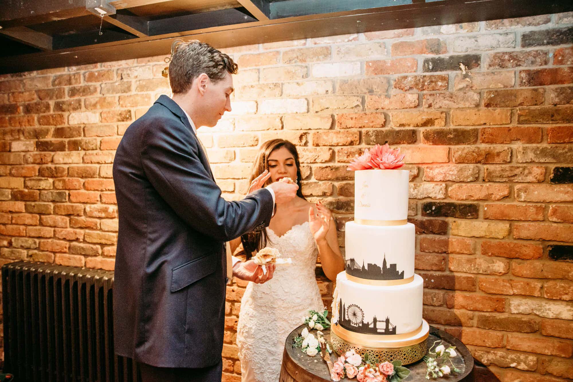 dickens-inn-tower-hill-london-london-wedding-photographer-roshni-photography-bride-groom-cake-cutting