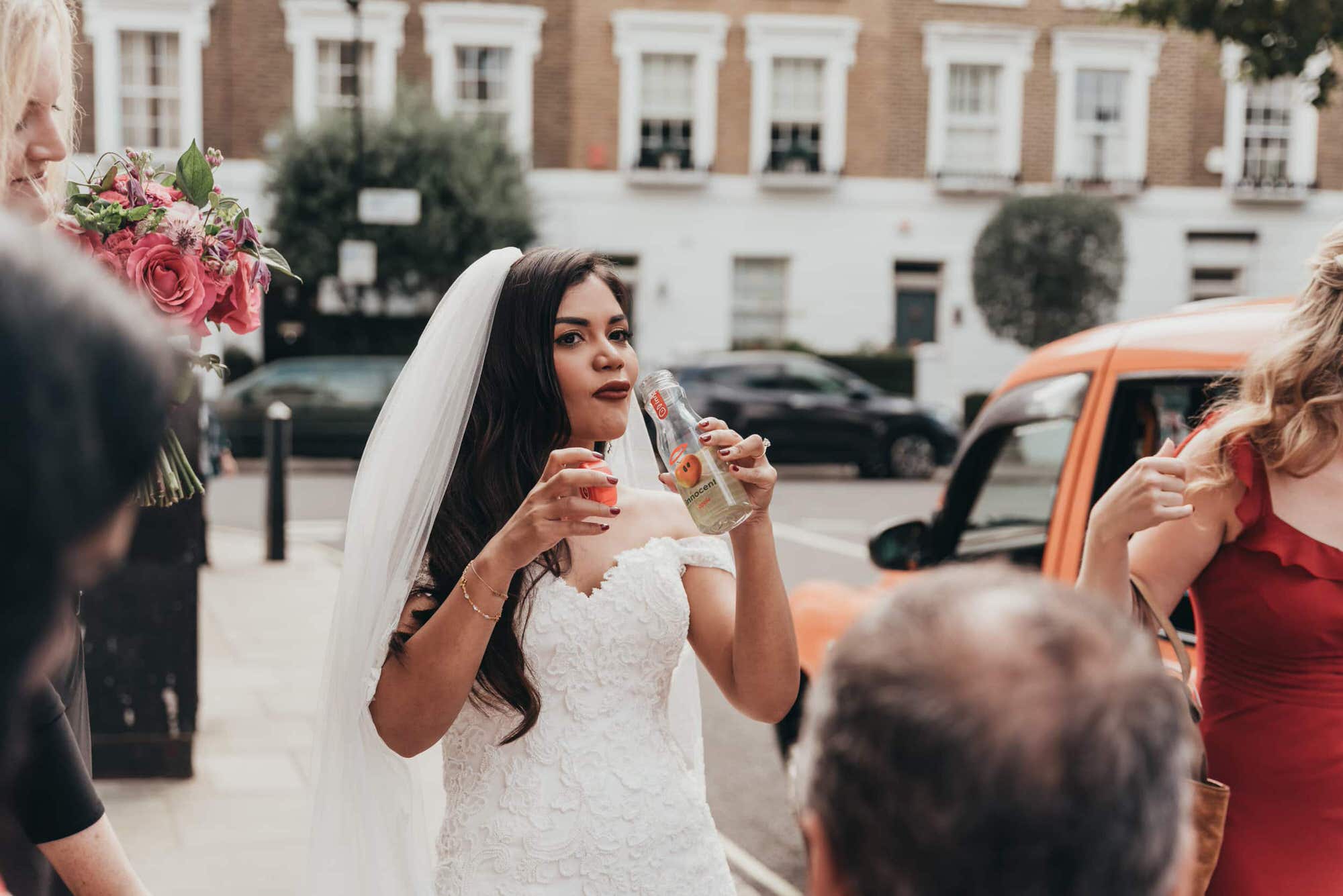 bride-drinking-before-fusion-wedding-ceremony-in-london-roshni-photography